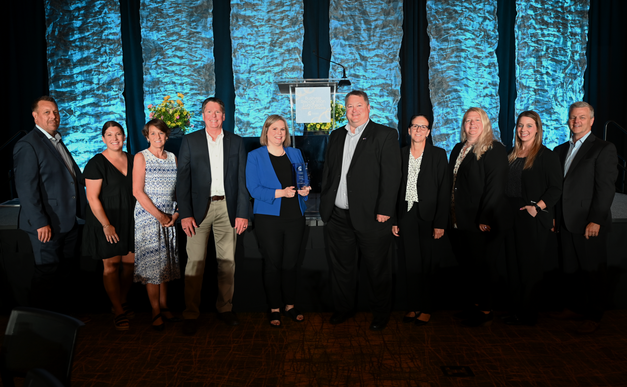 The BAYCOM team celebrates their “Growth Award” from the Green Bay Chamber of Commerce. Pictured left to right: Eric Urben, Samantha Himmelspach, Jane Latona, Tim Cooney, Katie Busch, Scott Johnson, Chris Adee, Katie Miner, Jenna Jennings, Mark Burseth